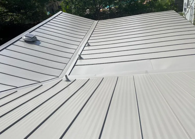 Solar attic fan installed on a metal roof for Roof Ventilation in Ewa Beach