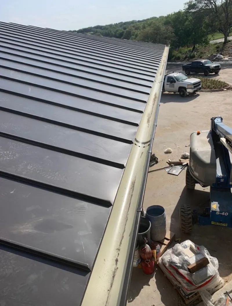 Standing seam panel and gutter detail on a metal roofing jobsite in Ewa Beach